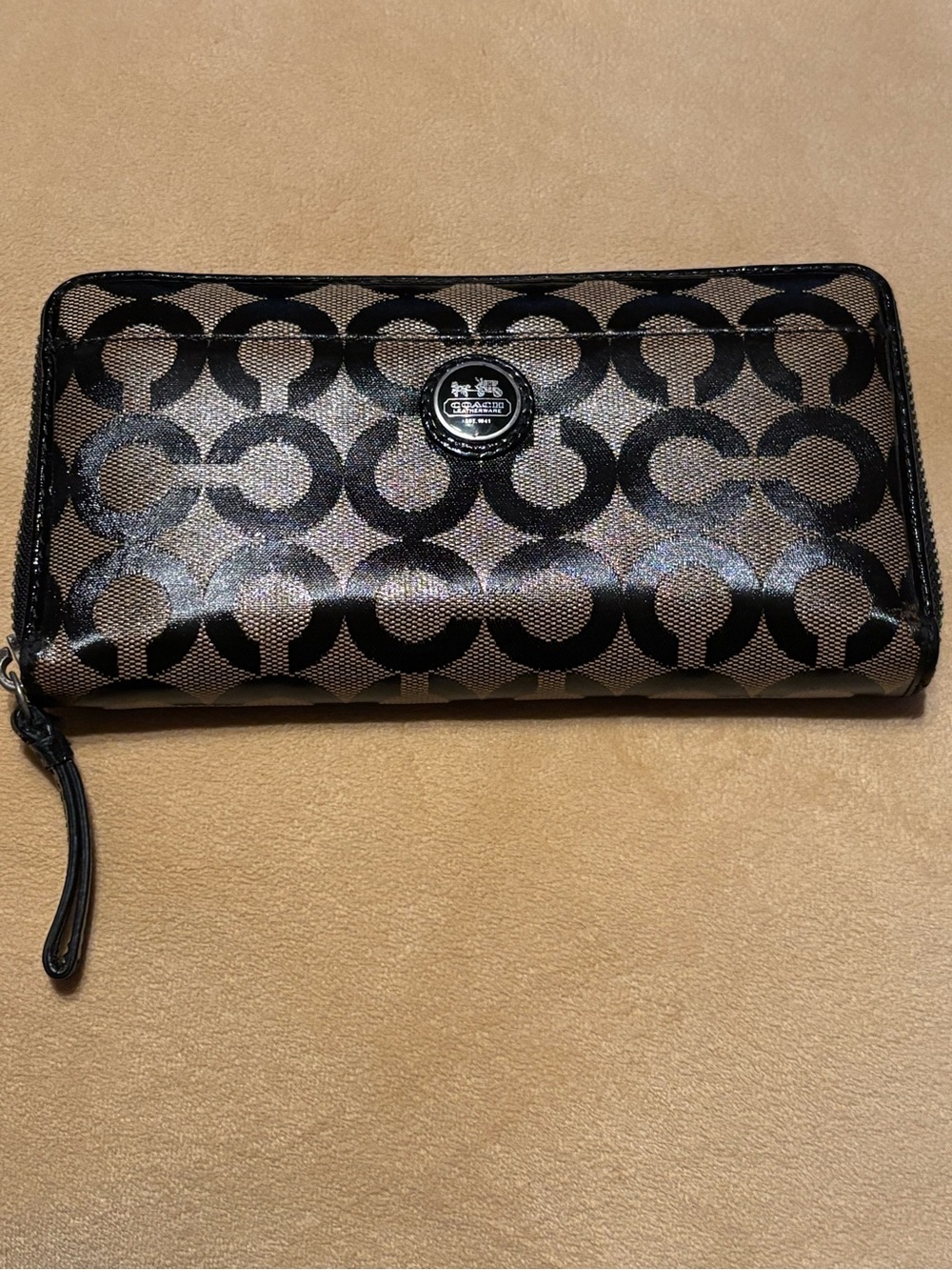 Coach Metallic Bronze and Black Signature full zip-around closure wallet